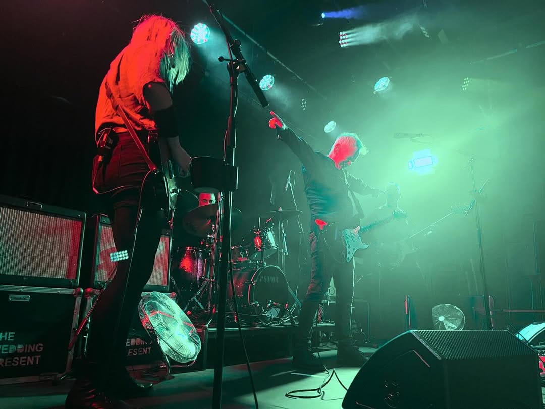 Band performing in a venue.
