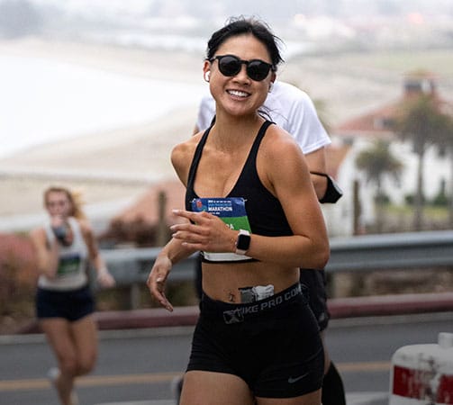 Close up shot of a person running the SF marathon