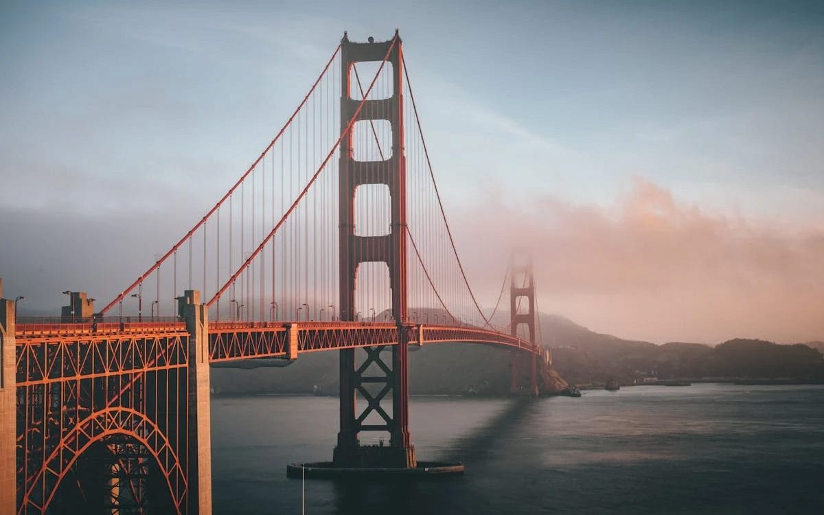 Golden Gate Bridge shrouded in fog during a cool, overcast day in San Francisco.