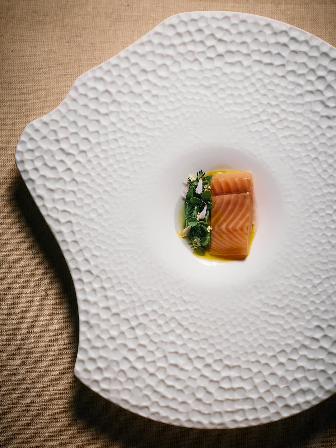 a simple and small portion of dish in pretty plate in a michelin restaurant of Sf perfect for Valentine 