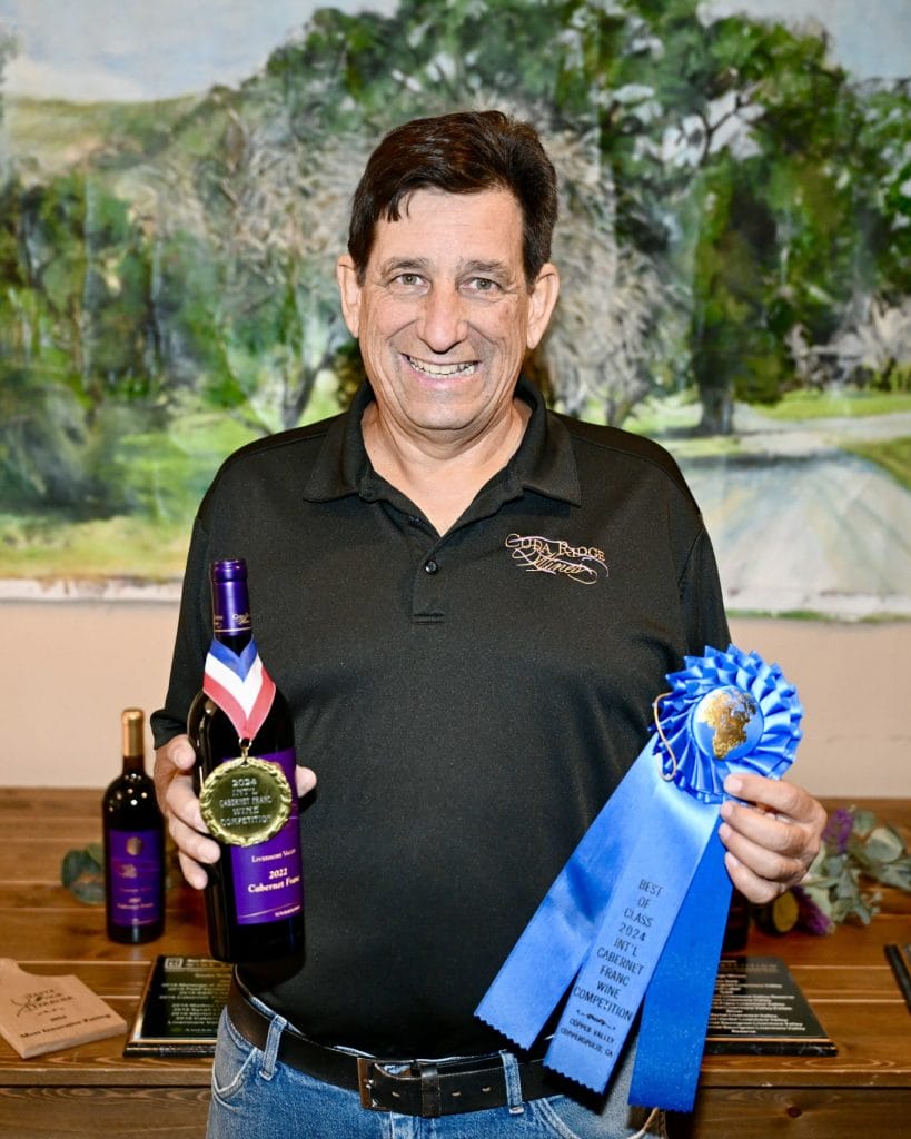 Winemaker holding wine bottle at Livermore Valley Harvest Wine Celebration