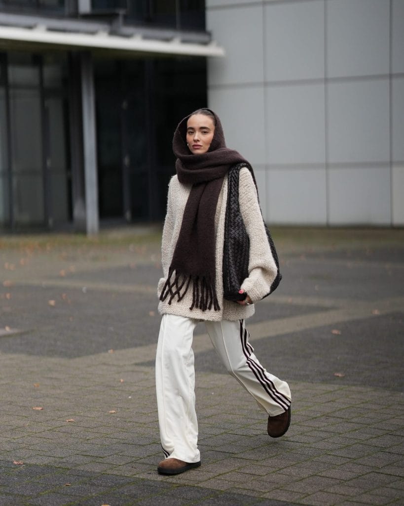 Winter accessories including scarf, beanie, and gloves for cold weather outfit