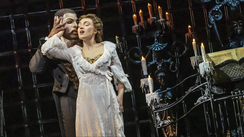 Stage scene from The Phantom of the Opera with two performers, candlelit set pieces, and a theatre backdrop for a San Francisco concerts and shows article.