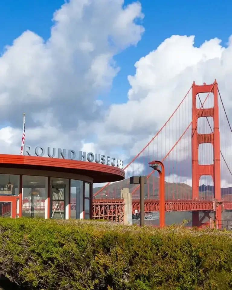 Round house cafe with a view of the Golden Gate Bridge in the background
