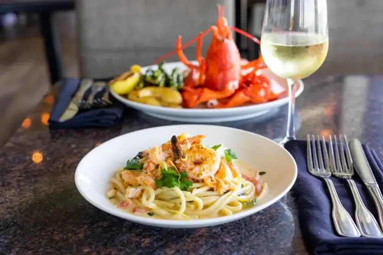 lobster and pasta along with champagne