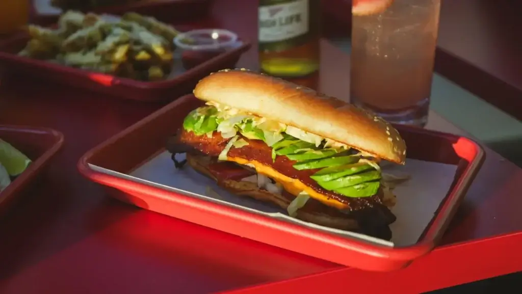 fried chicken sandwich from Quik Dog in San Francisco, fried chicken lettuce avocado and cheese