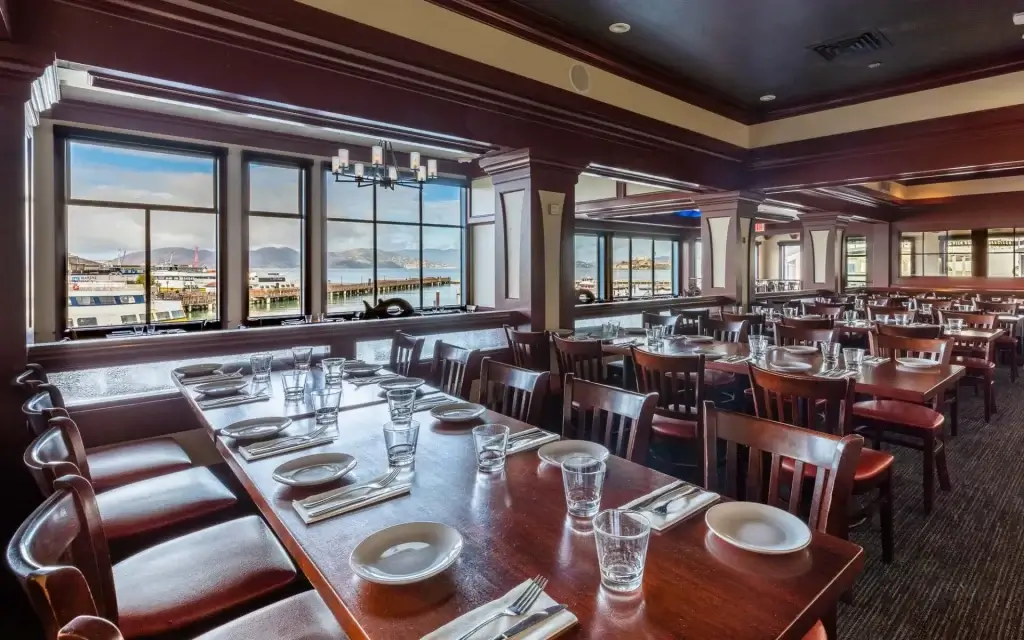 Fog Harbor Fish House located on Pier 39, offers views of the Golden Gate Bridge