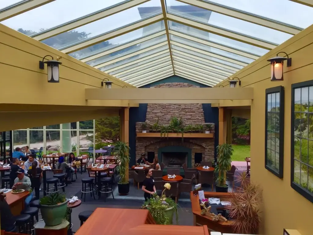 Park Chalet restaurant in San Francisco, large stone fireplace and a glass ceiling atrium