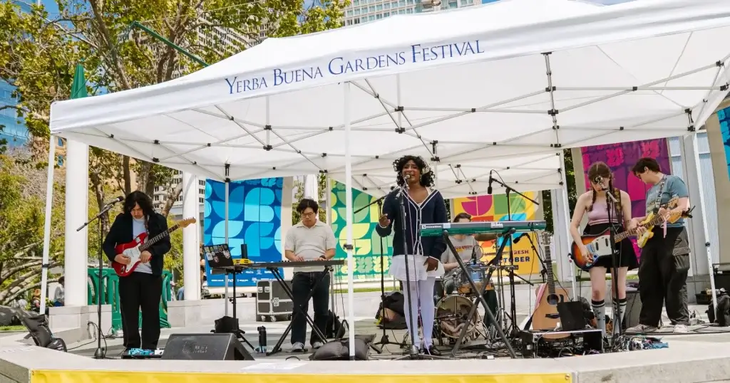 Local Sirens band performing under a Yerba Buena Gardens Festival tent in San Francisco.
