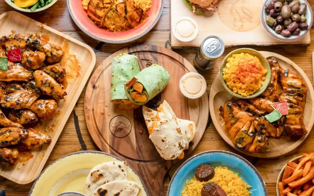 flame grilled peri peri chicken platter and wraps. The Port of Peri Peri a restaurant near Oracle Park