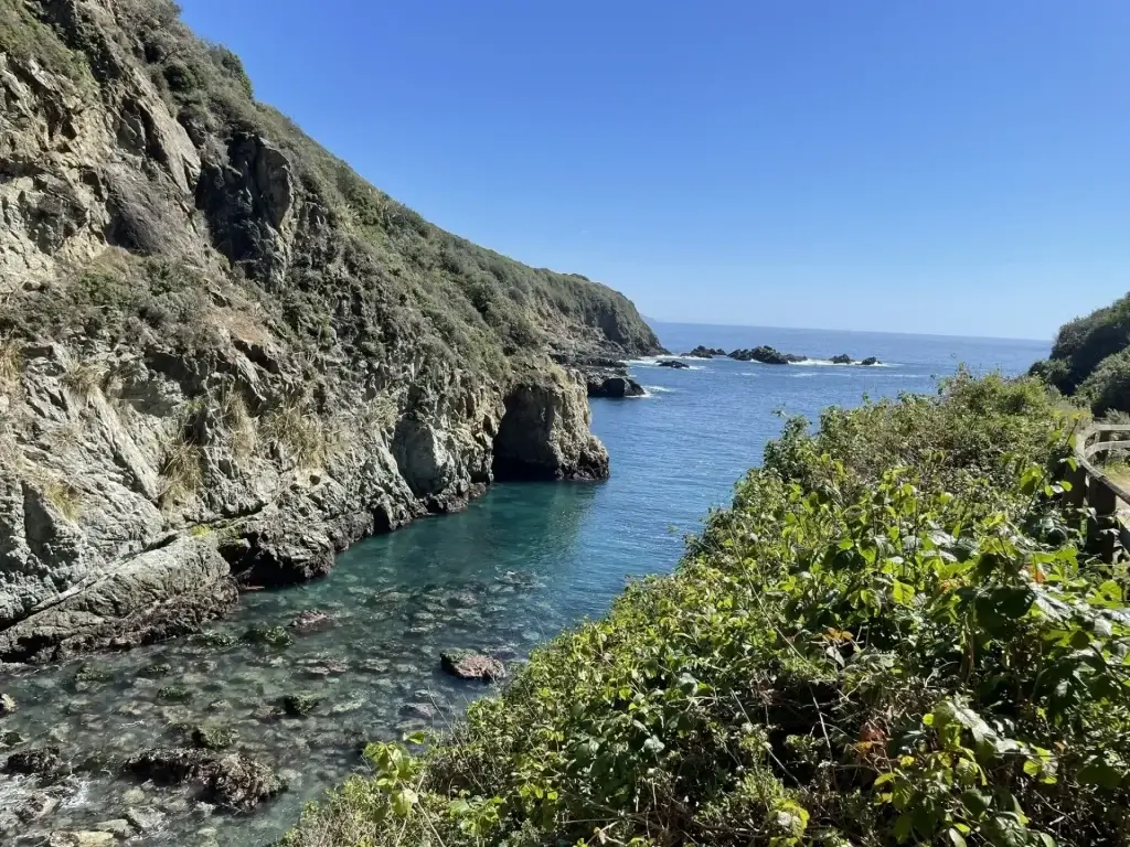 Coastal view of Partington Cove Trail overlooking the ocean inlet and rugged shoreline of Julia Pfeiffer Burns State Park