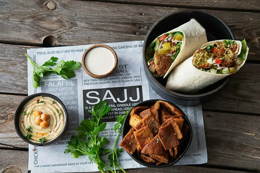 SAJJ Mediterranean highlighting falafel wraps and pita chips, restaurants near Oracle Park San Francisco