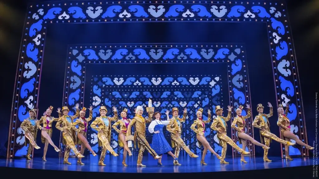 Cast of Disney’s Beauty and the Beast performing on stage at the Orpheum Theatre in San Francisco, with dancers in gold costumes and Belle standing center stage.