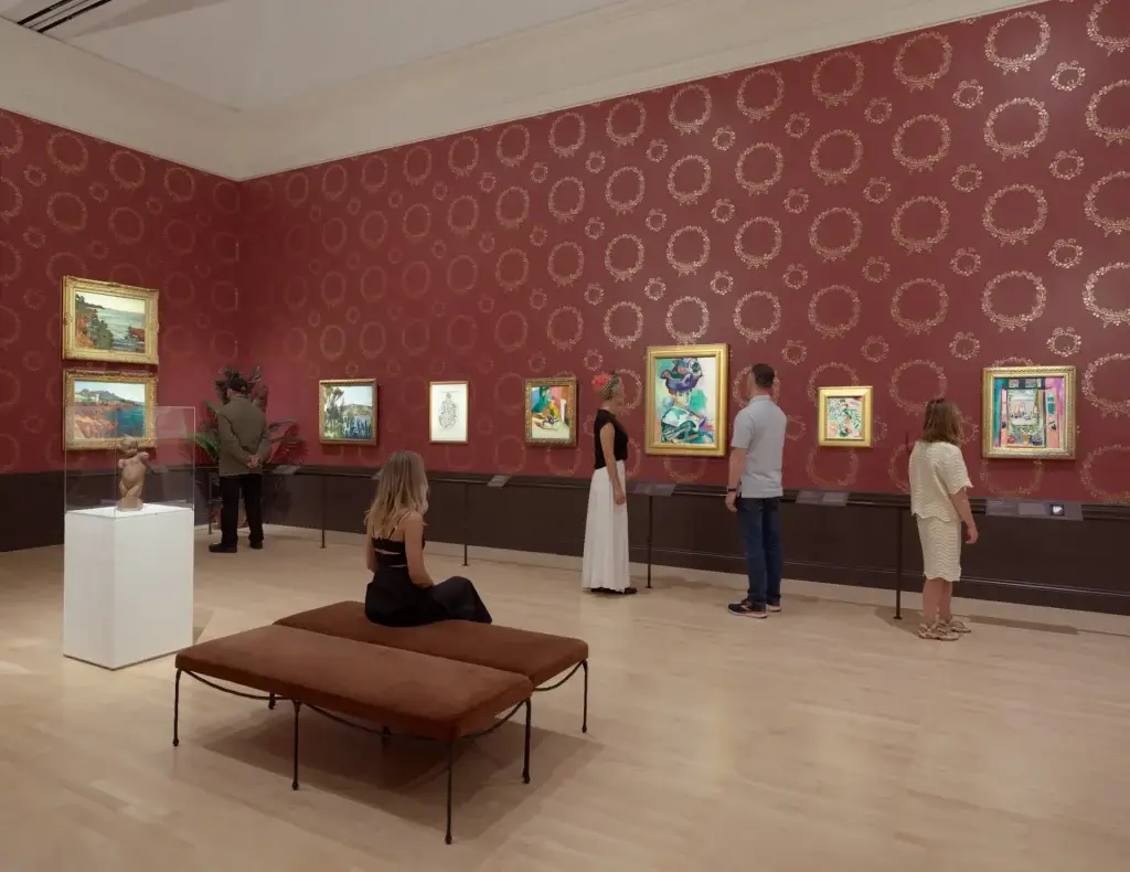 Visitors viewing colorful artwork in the Matisse exhibition gallery at SFMOMA in San Francisco.