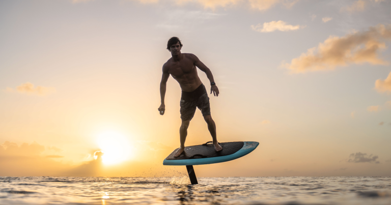 man eFoil surfing on the water